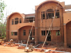 Building with compressed stabilized earth blocks