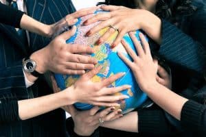 Various hands holding globe - The Vitality Map excerpt