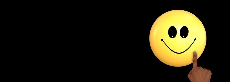 finger drawing a smiley face