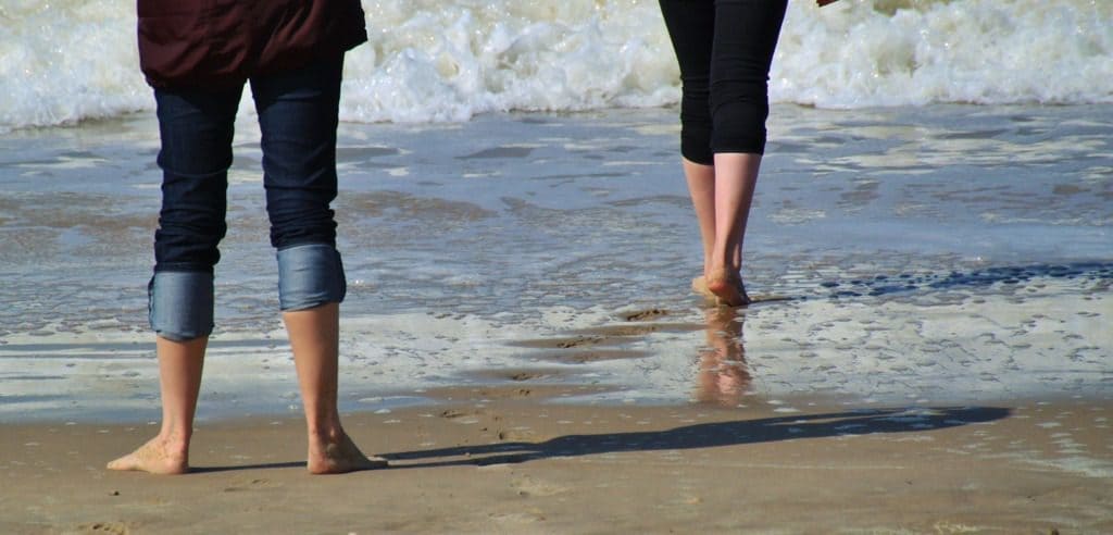 walking barefoot on the beach