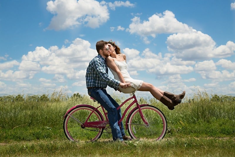 man and girl on bicycle