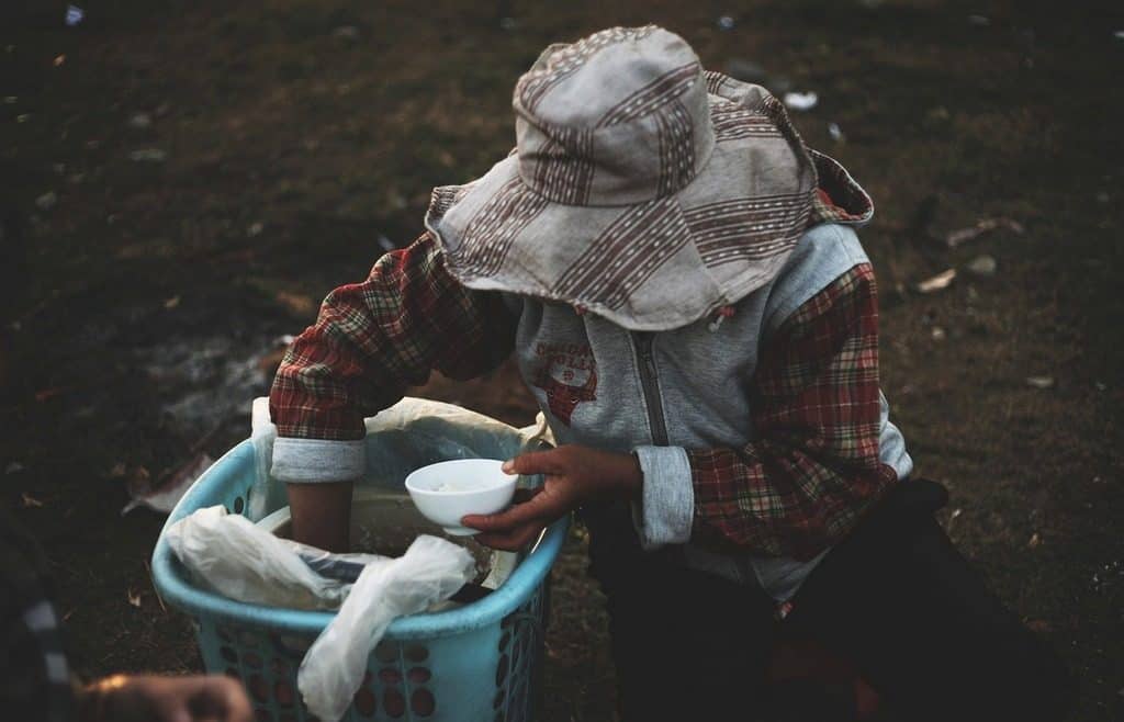 woman handing out food