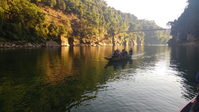 people in boat on river