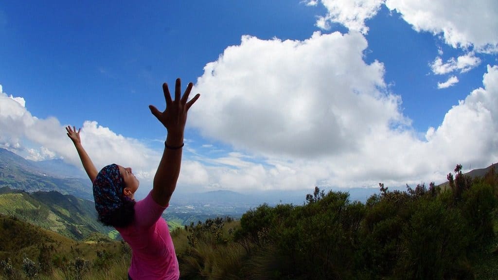 woman with hands in the air enjoying the view