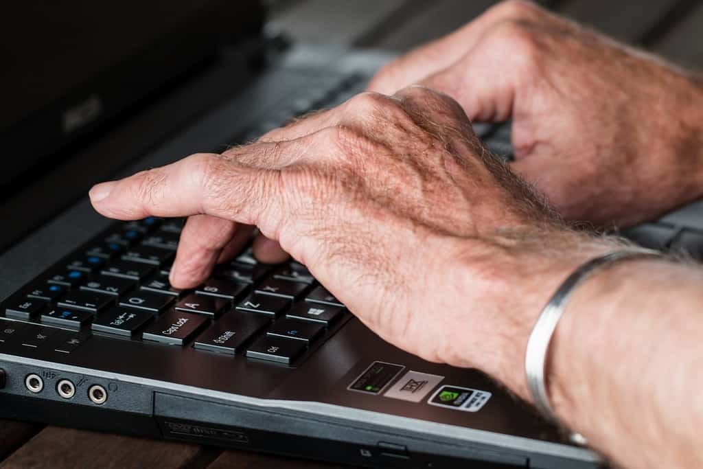 senior person with laptop