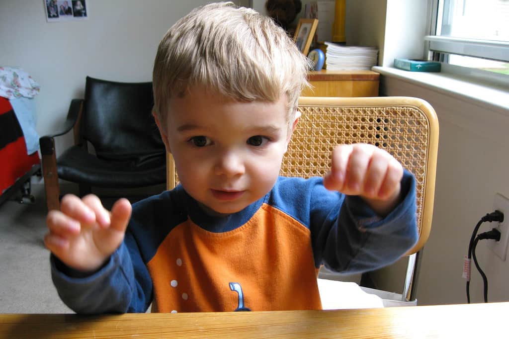 young boy learning the alphabet by listening to music