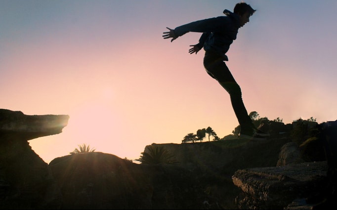 Boy about to jump off cliff