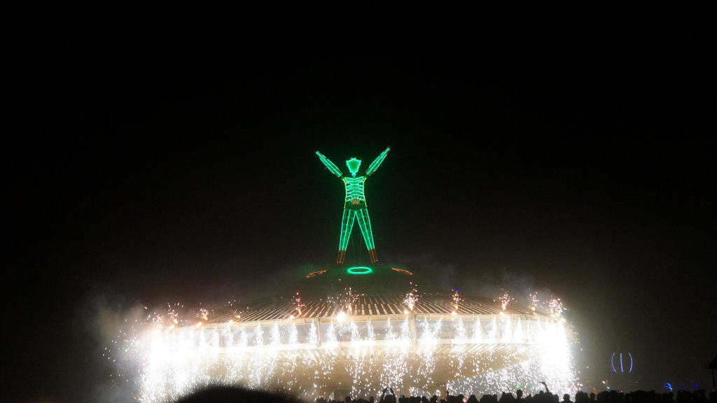 neon man among lights