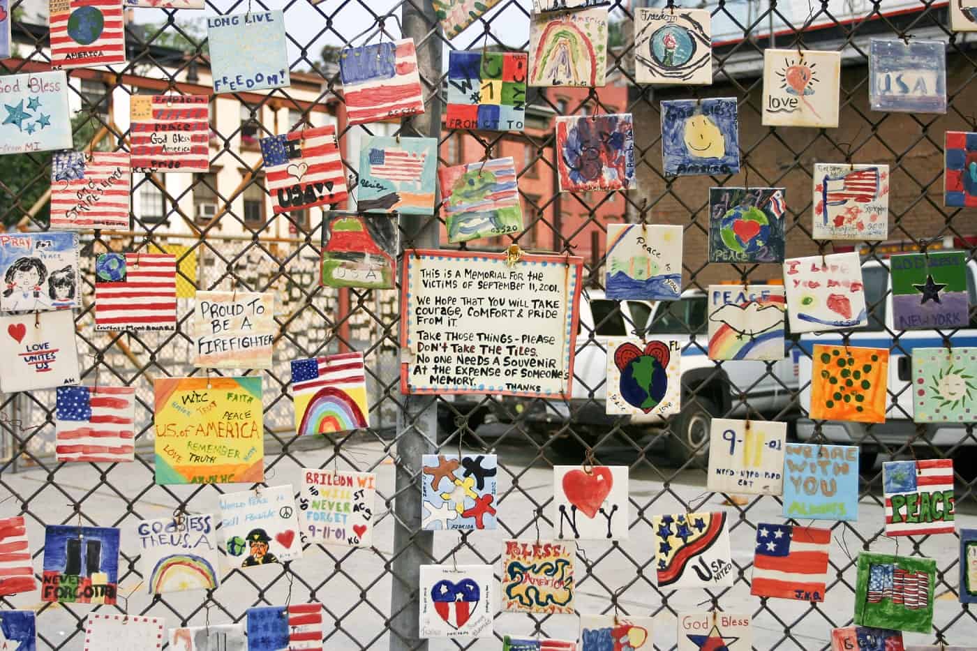 9/11 art on fence of car lot in New York City
