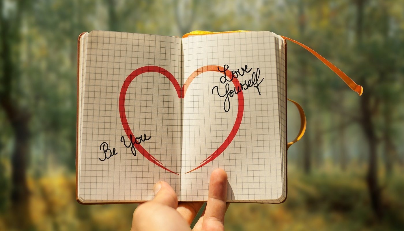 heart drawn on page with words 'love yourself'