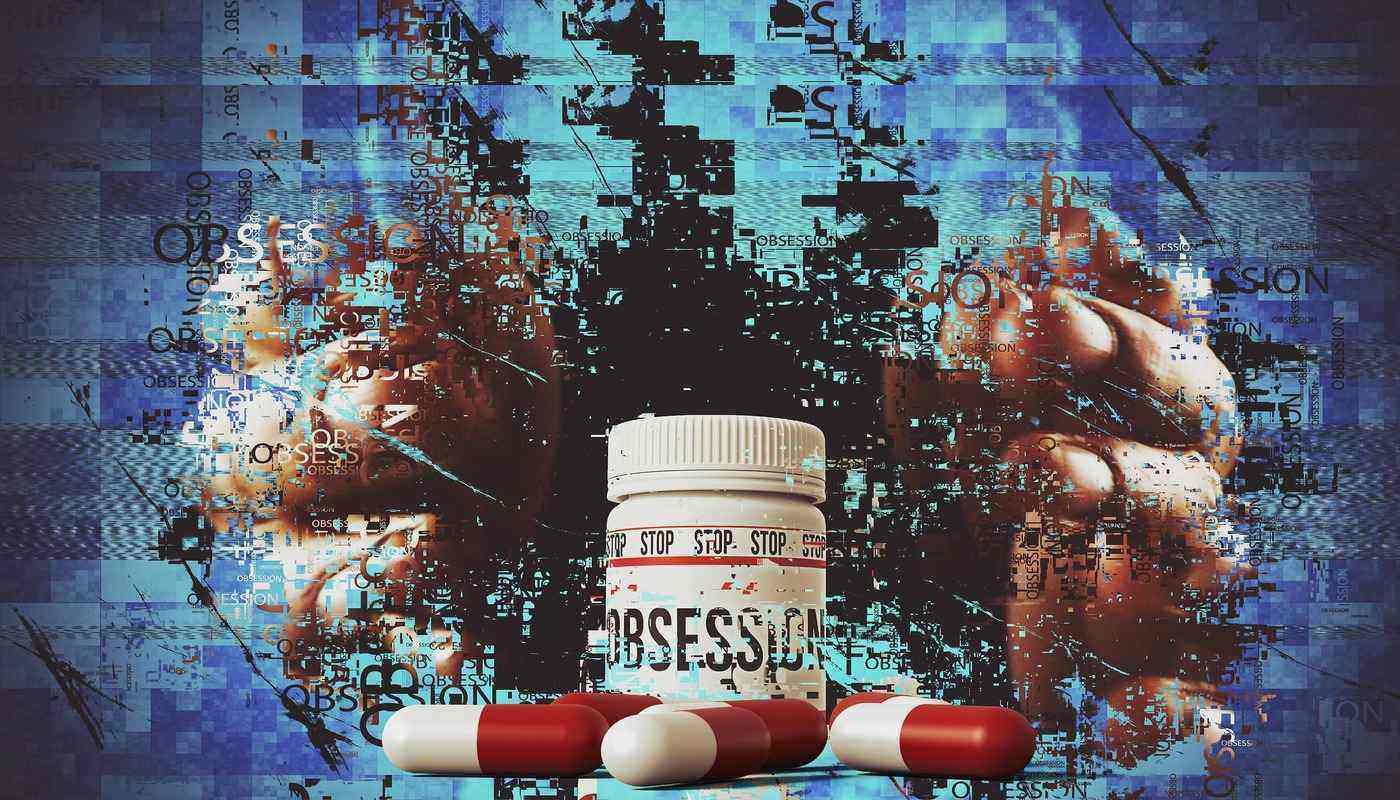pills and sign saying obsession