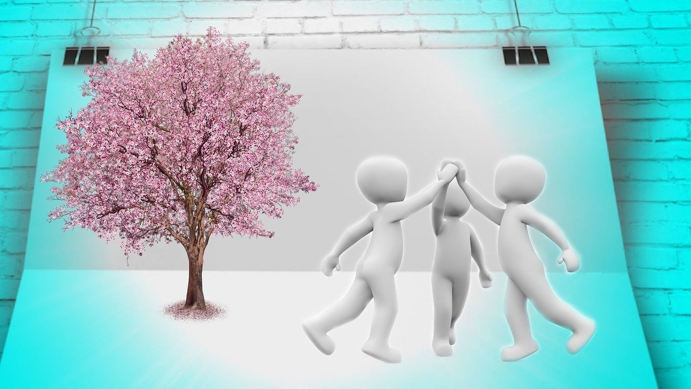 paper figures holding hands