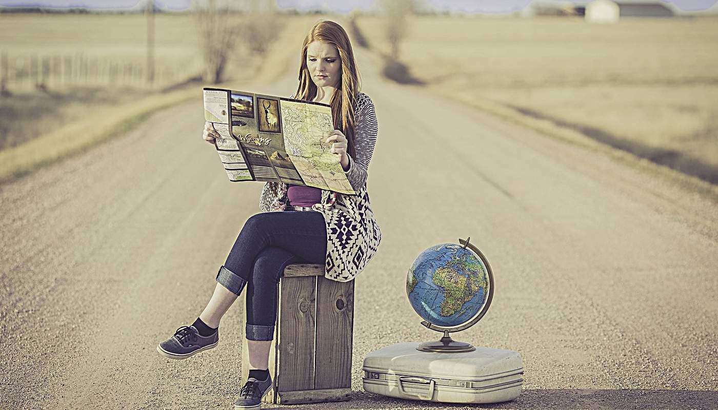 girl studying a map